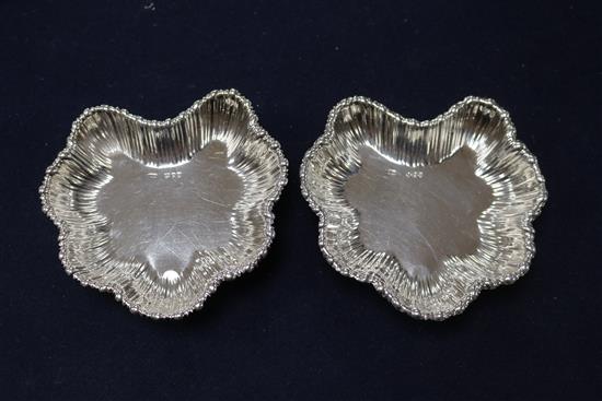 A pair of Victorian silver butter dishes and Onslow handled butter knives, cased, London 1891.